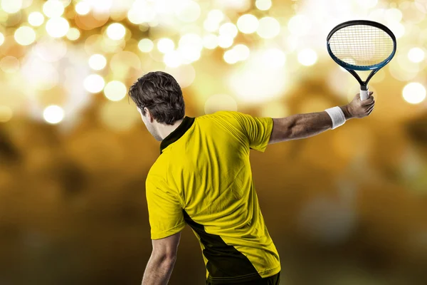 Tennis player with a yellow shirt. — Stock Photo, Image