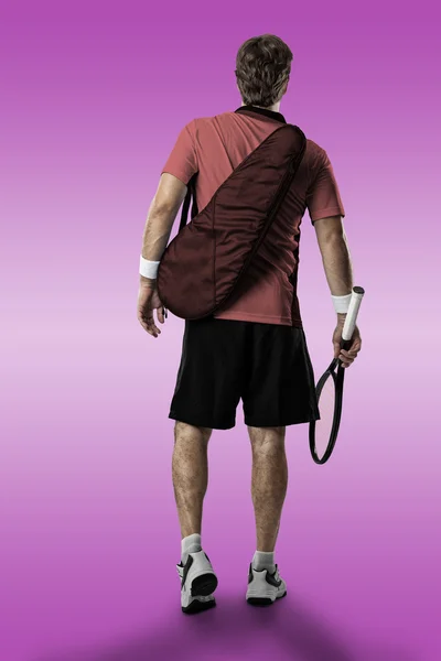 Jogador de tênis com uma camisa rosa . — Fotografia de Stock