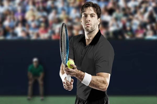 Tennis player with a black shirt. — Stock Photo, Image