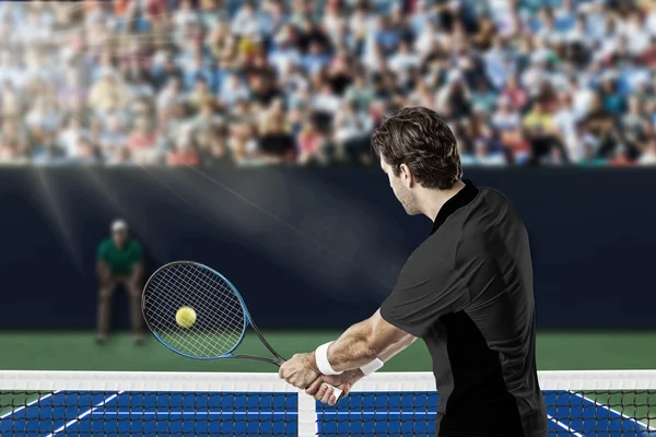 Tennis player with a black shirt. — Stock Photo, Image