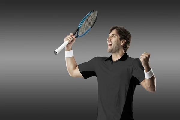 Tennis player with a black shirt. — Stock Photo, Image