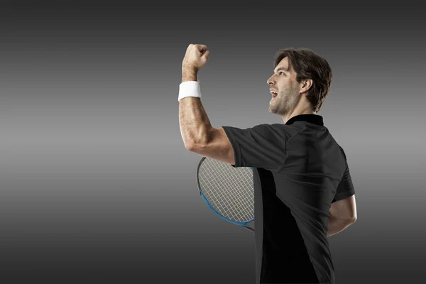 Tennis player with a black shirt. — Stock Photo, Image