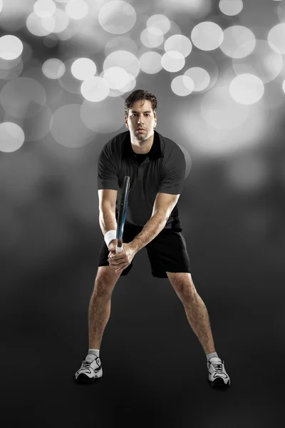 Tennis player with a black shirt. — Stock Photo, Image