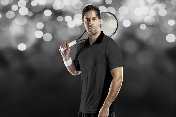 Tennisspelare med en svart tröja. — Stockfoto