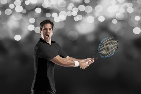 Tennis player with a black shirt. — Stock Photo, Image