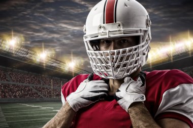 Futbolcu üzerinde kırmızı üniforma