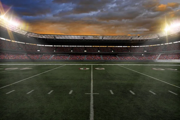 Football Stadium with fans wearing red uniforms — Stock Photo, Image