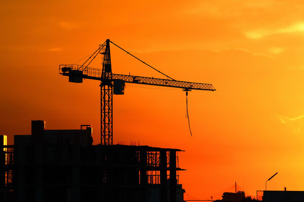 Silhouette Crane on Sunset Background