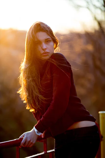 Portrait of beautiful young brunette girl in the Park — Stock Photo, Image