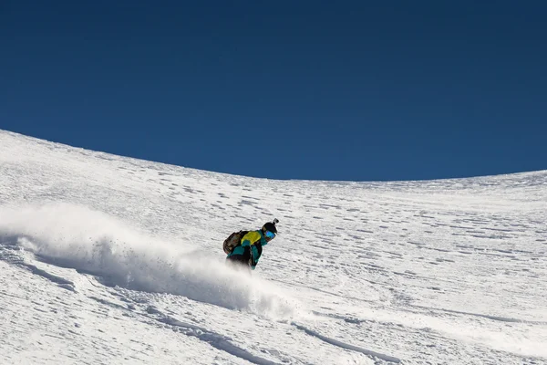 Man snowboarder snowboarding on fresh white snow — Stock Photo, Image