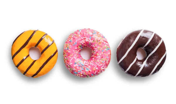 Три Разноцветные Пончики Изолированы Белом Фоне — стоковое фото