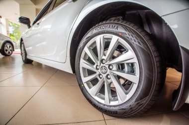 Uzhhorod, Ukraine. January 2021 white car of the Japanese brand Toyota CAMRY hybrid. Sedan, business. Reliable and beautiful car. The car in the cabin.	