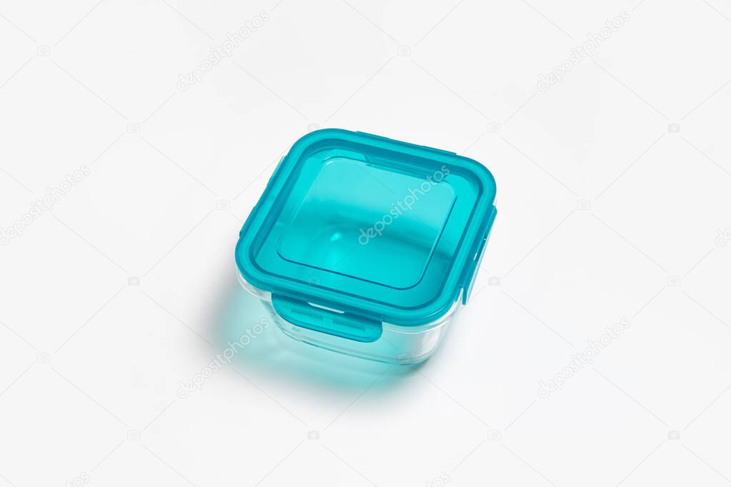 Glass food container with plastic lid isolated on white background. Storage container.High-resolution photo.