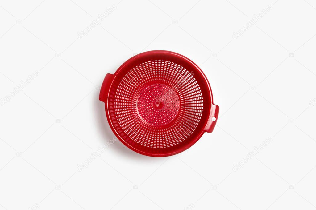 Plastic colander isolated on white background. High-resolution photo.