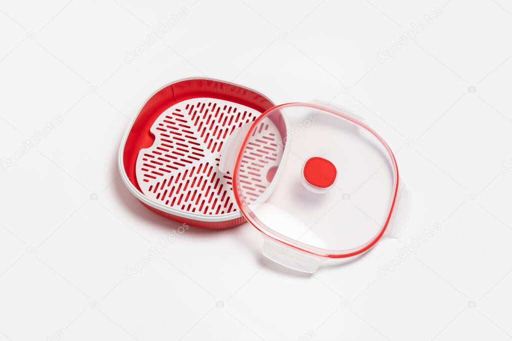 Plastic microwave Dish Steamer with lid isolated on white background.High-resolution photo.Top view. Mock-up.