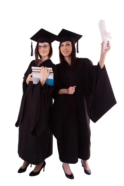 Chicas jóvenes en manto de estudiante con diploma y libros —  Fotos de Stock