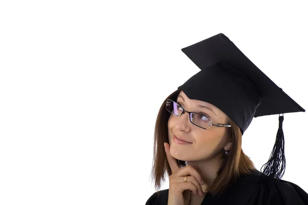 Chica joven en el manto de estudiante mirando de ensueño —  Fotos de Stock