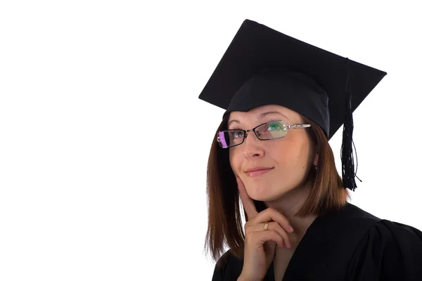 Young girl in student mantle looking dreamily — Stock Photo, Image