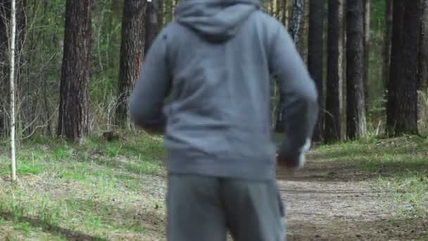 Man is jogging at the forest — Stock Video