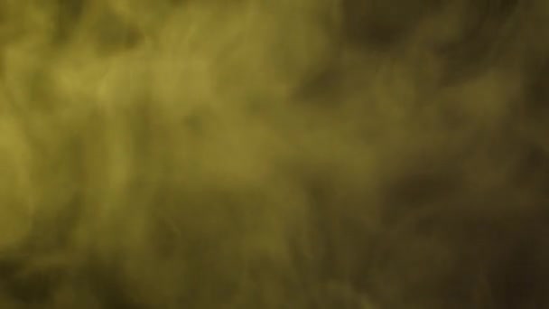 Yellow abstract smoke on black background — Stock Video