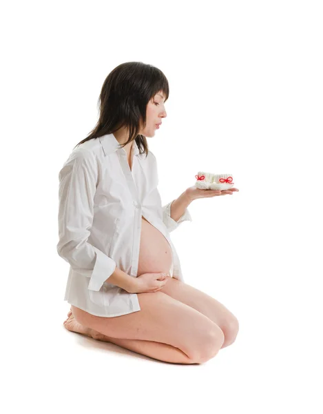 De jonge zwangere vrouw Stockfoto