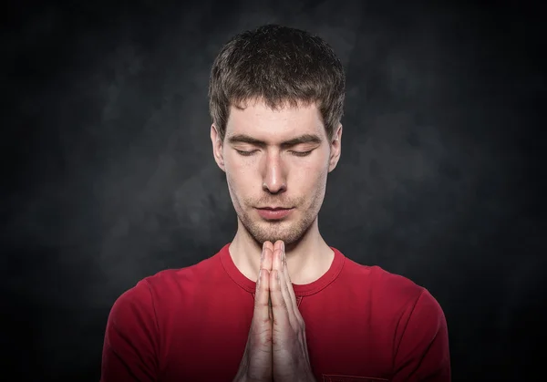 Man praying with hands clasped. — Stock Photo, Image