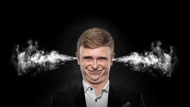 Stressful man with smoke coming out from his ears. clipart