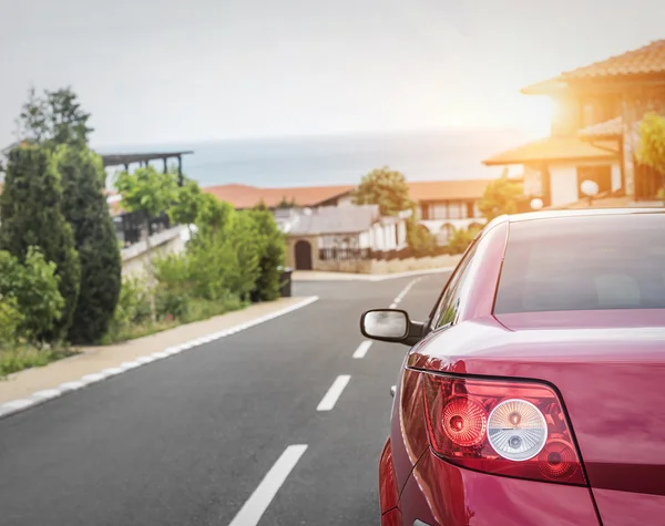 Red car on city streets. — Stock Photo, Image