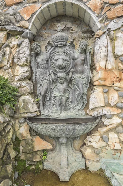 Ancient fountain on old wall. — Stock Photo, Image