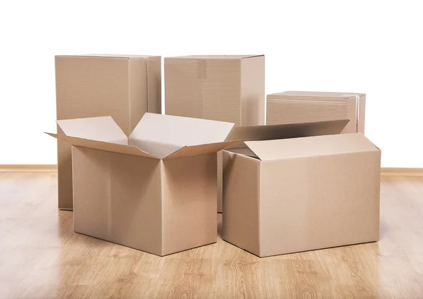 Moving boxes on the floor. — Stock Photo, Image