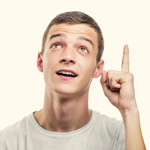 Jovem mostrando o dedo indicador para cima . — Fotografia de Stock