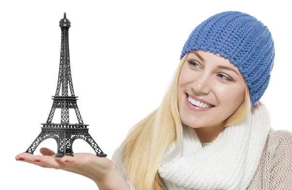 Beautiful blonde holding Eiffel Tower model. — Stock Photo, Image