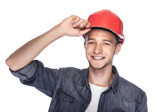 Jeune homme dans un casque de construction . — Photo