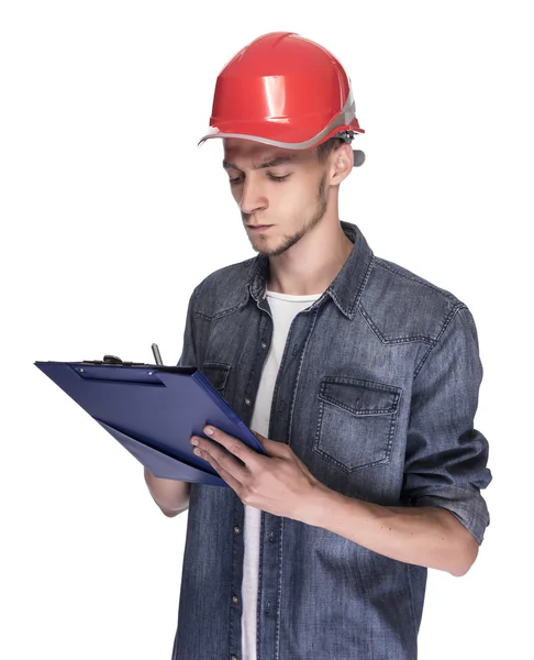 Молодой человек в строительном шлеме . — стоковое фото