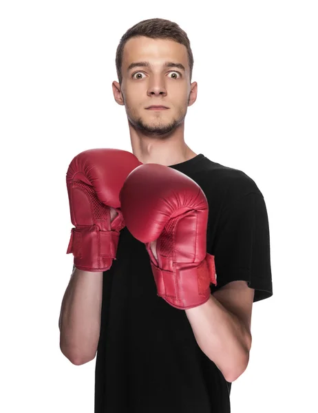 Cowardly young man in red boxing boxing gloves. — Stock Photo, Image