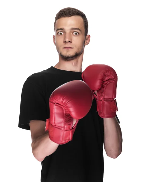 Cowardly young man in red boxing boxing gloves. — Stock Photo, Image