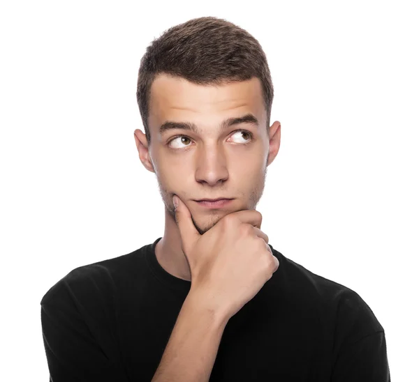 Young man thinking about something pleasant. — Stock Photo, Image