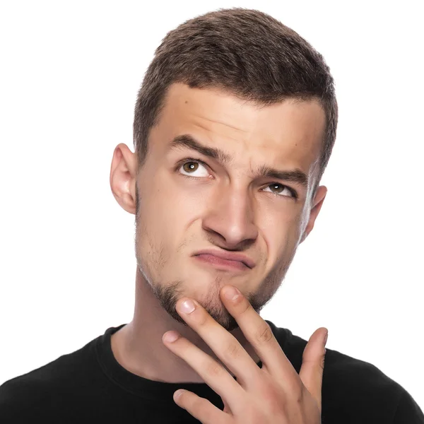 Young man thinking about something pleasant. — Stock Photo, Image