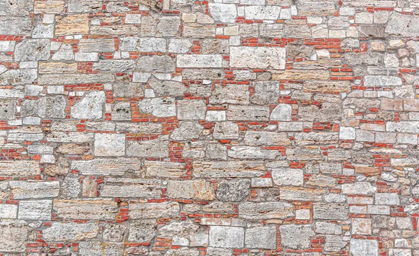 Pared de ladrillos grises viejos y piedra como fondo abstracto —  Fotos de Stock