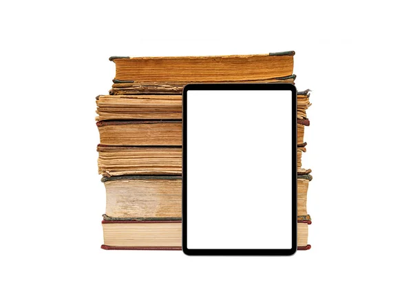 Tablet on the background of a stack of old books isolated on a white background. — Stock Photo, Image