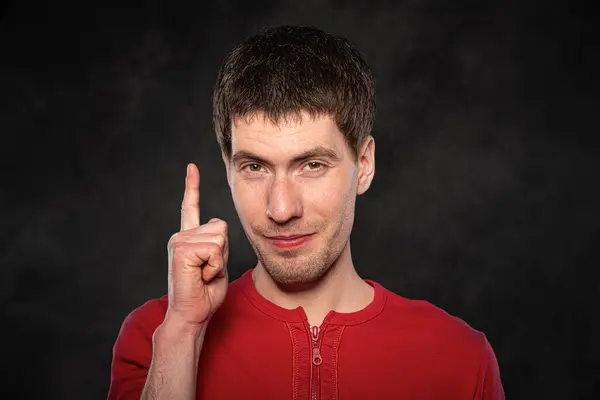 Funny young guy portrait isolated on dark background — Stock Photo, Image