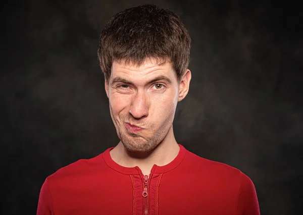 Funny young guy portrait isolated on dark background — Stock Photo, Image