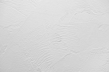 Arkaplan olarak taş gri duvar.