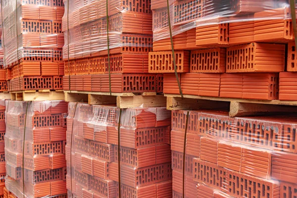 A stack of red sealed bricks.
