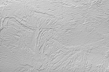 Arkaplan olarak taş gri duvar.