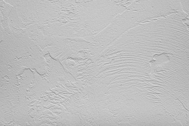 Arkaplan olarak taş gri duvar.