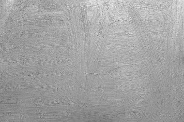 Arkaplan olarak taş gri duvar.