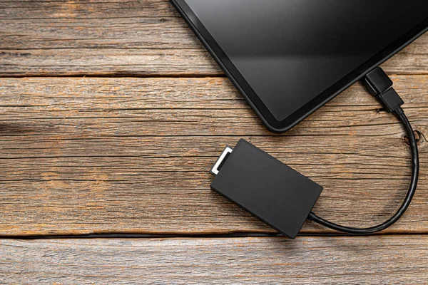 Memory card or external hard drive is connected to the Tablet PC. — Stock Photo, Image