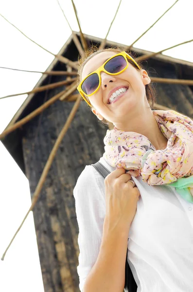 Tourist on the background of the old mill — Stock Photo, Image