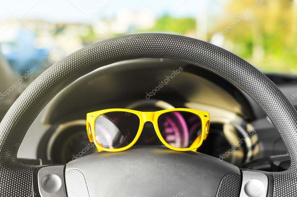 Yellow glasses on the wheel. 